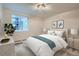 Serene bedroom featuring a comfortable bed, ample natural light from the window, and tasteful decor for a relaxing atmosphere at 336 N Grant St # 412, Denver, CO 80203