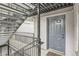 Apartment building entry featuring metal stairs and railing leading to the door marked 312 at 336 N Grant St # 412, Denver, CO 80203