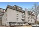 Brick apartment building featuring multiple stories, parking, and roof top access at 336 N Grant St # 412, Denver, CO 80203