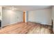 Empty living room featuring hardwood floors, a fireplace, large windows, and access to the kitchen and dining areas at 336 N Grant St # 412, Denver, CO 80203