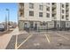 Designated parking area showcasing assigned spaces with building in the background at 336 N Grant St # 412, Denver, CO 80203