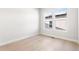 An empty bedroom with hardwood floors and a large window at 6675 Fawn Path Ln, Castle Pines, CO 80108