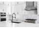 Bright kitchen featuring a large island with a white countertop, modern stainless steel appliances, and cabinets at 6675 Fawn Path Ln, Castle Pines, CO 80108
