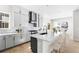 Bright, open kitchen with a large island, stainless steel appliances, and hardwood floors at 6675 Fawn Path Ln, Castle Pines, CO 80108