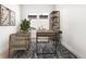 A modern office space with hardwood floors and a metal bookshelf at 6675 Fawn Path Ln, Castle Pines, CO 80108