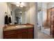 Bathroom featuring tile flooring, wood vanity, and neutral wall colors at 4275 S Dawson St, Aurora, CO 80014