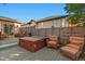 Backyard deck with a hot tub, patio heater, privacy fence, and comfortable seating arrangement at 4275 S Dawson St, Aurora, CO 80014