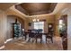Formal dining room featuring a chandelier and ample seating at 4275 S Dawson St, Aurora, CO 80014