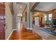 Long hallway with wood flooring and arched entryways at 4275 S Dawson St, Aurora, CO 80014