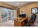 Bright home office with a view to the outside, a large desk, and a comfortable chair at 4275 S Dawson St, Aurora, CO 80014