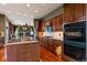 Modern kitchen featuring stainless appliances, granite countertops, and seamless flow to the living room at 4275 S Dawson St, Aurora, CO 80014