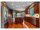 Spacious kitchen with stainless steel appliances, a large island, and beautiful wood cabinetry at 4275 S Dawson St, Aurora, CO 80014