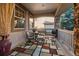 Covered patio with outdoor seating and a patterned rug at 4275 S Dawson St, Aurora, CO 80014