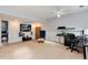 Finished basement with large TV, shelving, and workspace at 831 Centennial Dr, Bennett, CO 80102