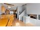 Open dining room with wood table and chairs, adjacent to the kitchen at 831 Centennial Dr, Bennett, CO 80102