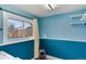 Laundry room with shelving and window at 831 Centennial Dr, Bennett, CO 80102