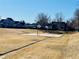 Outdoor basketball court surrounded by residential homes and mature trees at 5129 Mt Arapaho Cir, Frederick, CO 80504