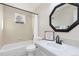 Bathroom features a tub and shower, vanity and stylish mirror at 5129 Mt Arapaho Cir, Frederick, CO 80504