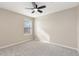 This bedroom has neutral walls, gray carpet and one window at 5129 Mt Arapaho Cir, Frederick, CO 80504