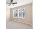 This bedroom has neutral walls, gray carpet and two windows at 5129 Mt Arapaho Cir, Frederick, CO 80504