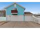 View of three car garage with white doors at 5129 Mt Arapaho Cir, Frederick, CO 80504