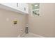 Laundry room features overhead cabinets and tile floors at 5129 Mt Arapaho Cir, Frederick, CO 80504