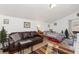 Inviting living area with a comfortable leather sofa and stylish coffee table at 5129 Mt Arapaho Cir, Frederick, CO 80504