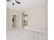 Serene main bedroom with doorway to ensuite bathroom at 5129 Mt Arapaho Cir, Frederick, CO 80504