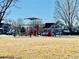 Community playground with swings, slides, and a shaded structure at 5129 Mt Arapaho Cir, Frederick, CO 80504