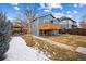 Blue two-story home featuring a backyard deck and patio at 1430 Fairfax St, Denver, CO 80220