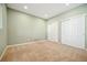 Carpeted bedroom with lots of natural light, neutral decor and double closets for ample storage at 1430 Fairfax St, Denver, CO 80220