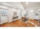 Inviting dining room featuring hardwood floors, tray ceiling and natural light from windows at 1430 Fairfax St, Denver, CO 80220