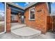 Charming brick home with a covered front porch and blue trim, showcasing the house number at 1430 Fairfax St, Denver, CO 80220