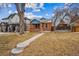 Charming brick home with landscaped front yard and inviting walkway at 1430 Fairfax St, Denver, CO 80220