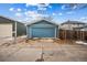 Spacious detached garage in a backyard setting, complemented by a concrete driveway for easy access at 1430 Fairfax St, Denver, CO 80220