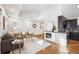 Bright living room featuring hardwood floors, a modern fireplace, and stylish, neutral decor at 1430 Fairfax St, Denver, CO 80220