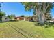 Expansive backyard with a storage shed, mature trees, and partially covered patio perfect for outdoor relaxation at 2236 S Osceola St, Denver, CO 80219