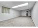 Spacious basement with carpet and light walls, perfect for a recreation room at 2236 S Osceola St, Denver, CO 80219