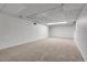 Unfinished basement space with neutral carpet, ready to be transformed at 2236 S Osceola St, Denver, CO 80219