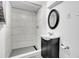 Modern bathroom featuring shower and vanity with contemporary fixtures at 2236 S Osceola St, Denver, CO 80219