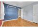 Spacious bedroom with hardwood floors, closet, and ample natural light at 2236 S Osceola St, Denver, CO 80219