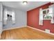 Cozy bedroom with hardwood floors, two windows, and neutral-colored walls at 2236 S Osceola St, Denver, CO 80219