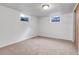 Finished basement bedroom with carpet and a window for natural light at 2236 S Osceola St, Denver, CO 80219