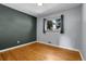 Comfortable bedroom featuring hardwood floors and a window for natural light at 2236 S Osceola St, Denver, CO 80219