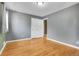 This bedroom features beautiful hardwood floors and a spacious closet at 2236 S Osceola St, Denver, CO 80219