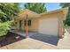 Charming brick home with a covered porch and attached one-car garage at 2236 S Osceola St, Denver, CO 80219