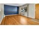 Open concept living room with hardwood floors and neutral paint at 2236 S Osceola St, Denver, CO 80219