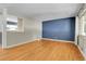 Spacious living room with hardwood floors and lots of natural light at 2236 S Osceola St, Denver, CO 80219