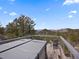 Outdoor deck featuring a hot tub with scenic mountain views in the background at 3945 Douglas Mountain Dr, Golden, CO 80403