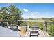 Outdoor deck with comfortable seating and stunning views of the surrounding mountain landscape at 3945 Douglas Mountain Dr, Golden, CO 80403